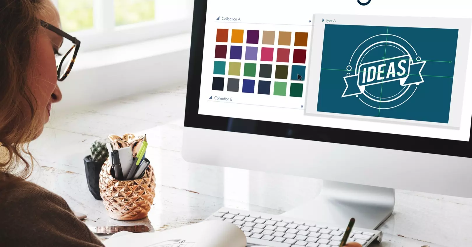 Graphic designer developing custom logo concepts and brand colour palettes for a Perth business