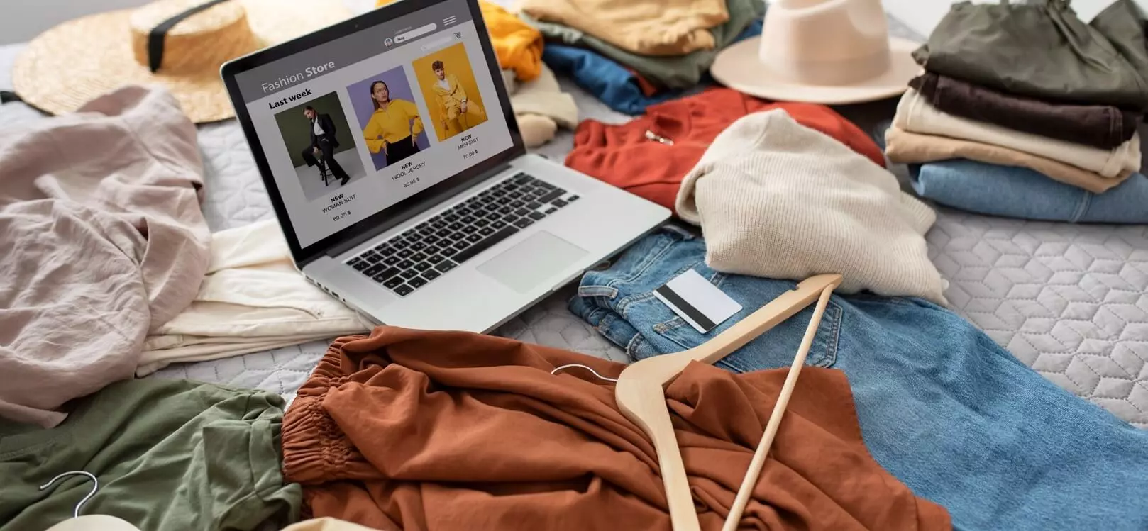 Custom WooCommerce fashion store designed by Web Wizards Perth displayed on a laptop with retail products